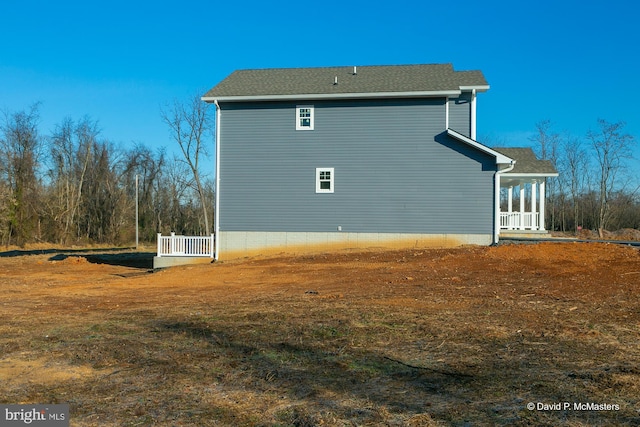 view of property exterior with a lawn