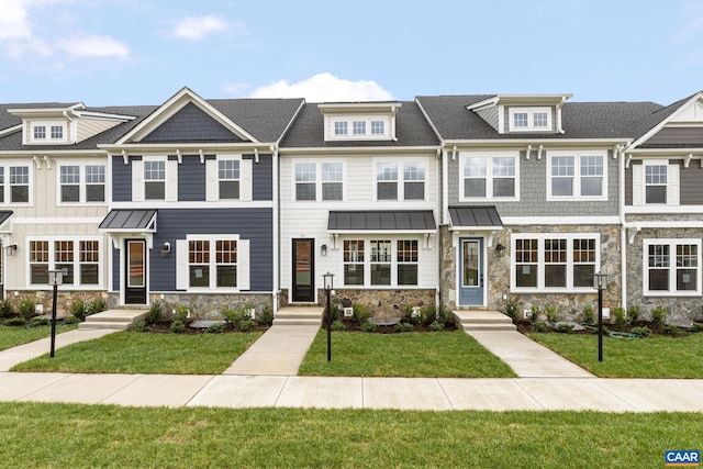 view of property featuring a front yard