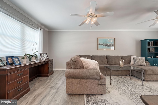 living room with light wood finished floors, ceiling fan, ornamental molding, and baseboards