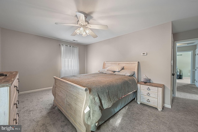 bedroom featuring carpet, visible vents, baseboards, and a ceiling fan