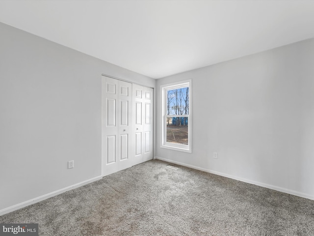 interior space with carpet flooring and a closet