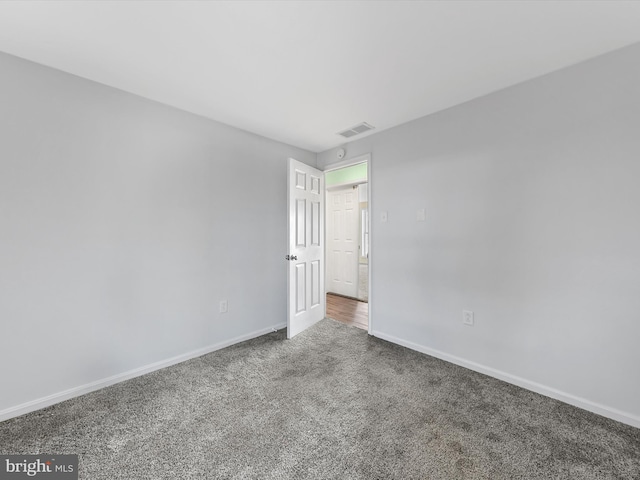 unfurnished room with carpet floors