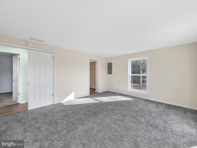 interior space featuring carpet flooring and electric panel