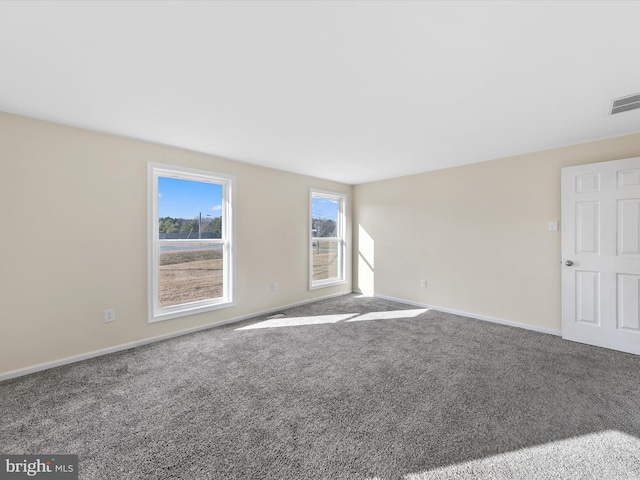 unfurnished room with carpet flooring