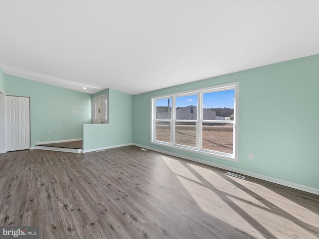 unfurnished living room with light wood-type flooring