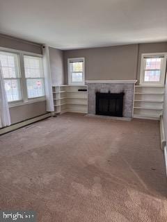 unfurnished living room featuring carpet floors