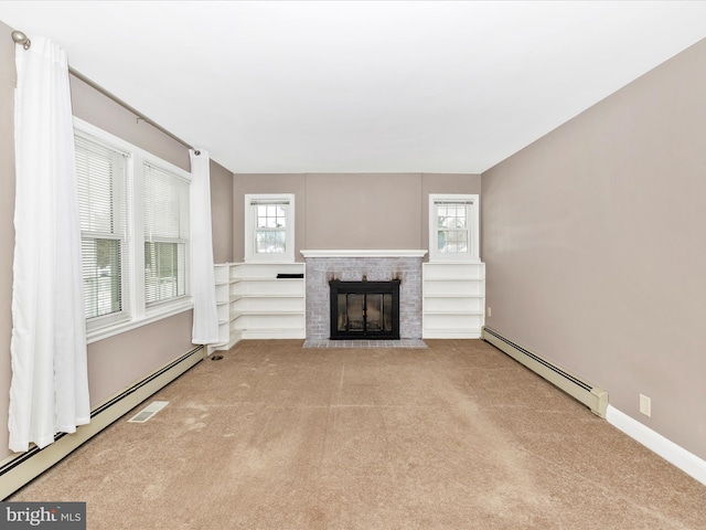 unfurnished living room with a fireplace, plenty of natural light, and baseboard heating