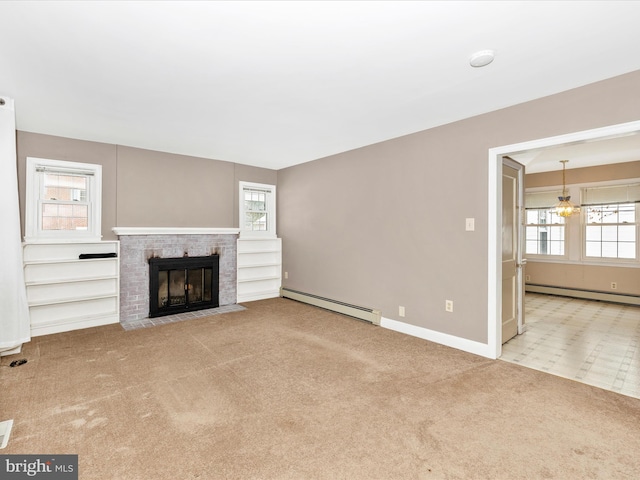 unfurnished living room with a brick fireplace, a chandelier, light colored carpet, and a baseboard heating unit