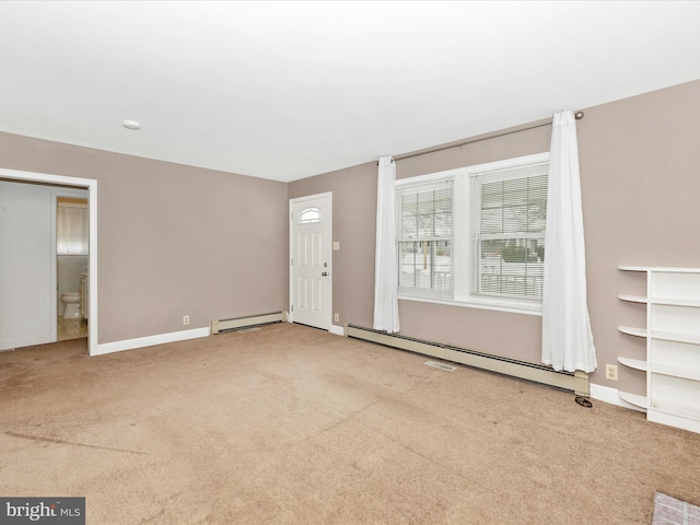 interior space featuring baseboard heating and light carpet