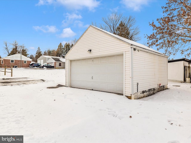 view of snow covered garage