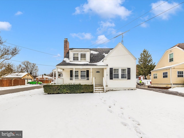 new england style home featuring a porch