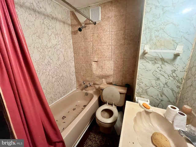 bathroom with toilet and shower / tub combo