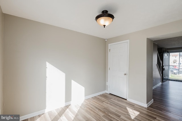 spare room with hardwood / wood-style floors