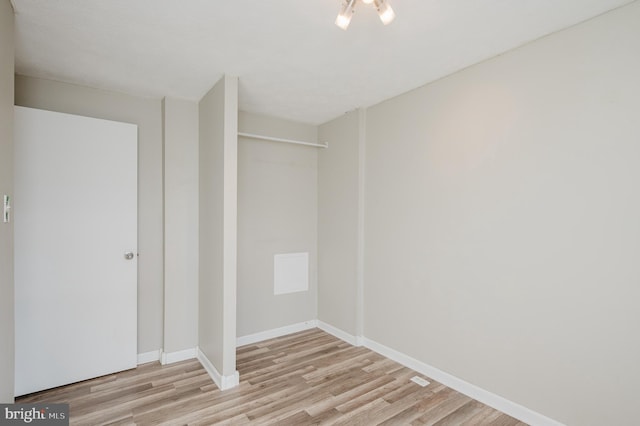 spare room with light hardwood / wood-style floors