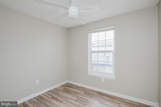 empty room featuring ceiling fan and light hardwood / wood-style flooring