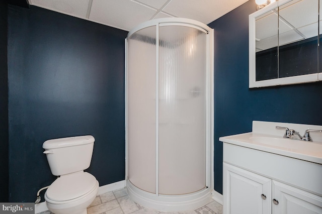 bathroom featuring toilet, a shower with door, vanity, and tile patterned flooring