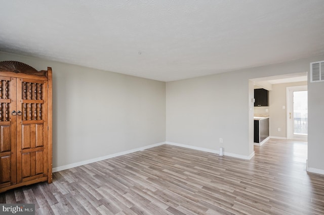 empty room featuring light hardwood / wood-style floors