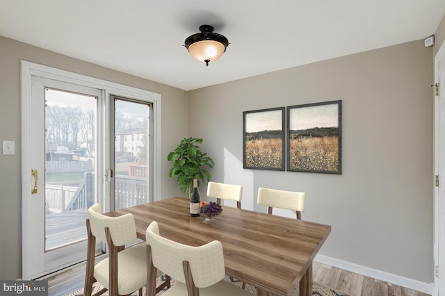 dining space featuring light hardwood / wood-style floors