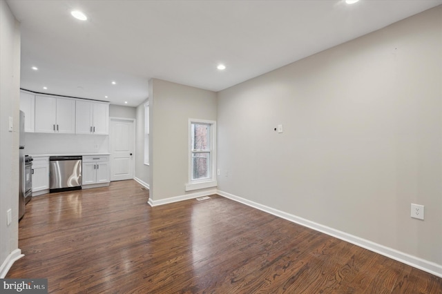 unfurnished living room featuring dark hardwood / wood-style flooring