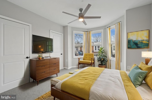 carpeted bedroom with ceiling fan