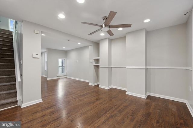 unfurnished room featuring ceiling fan and dark hardwood / wood-style flooring