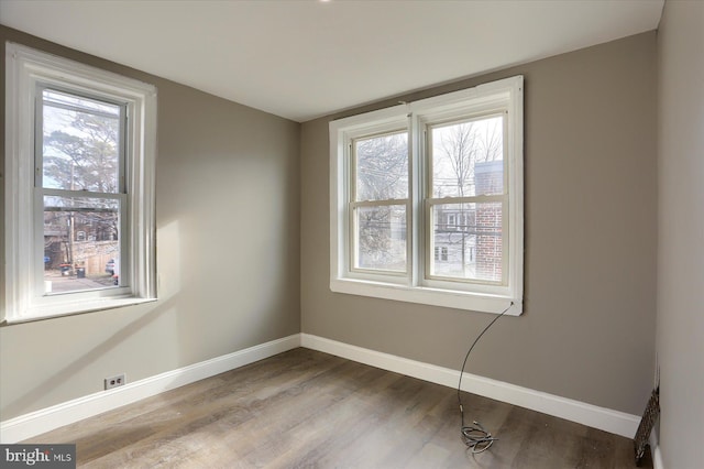 unfurnished room with light wood-type flooring