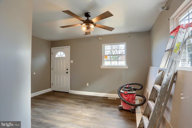 foyer entrance with hardwood / wood-style flooring and ceiling fan