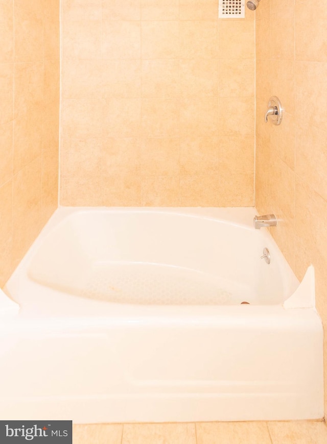 bathroom with tile patterned floors