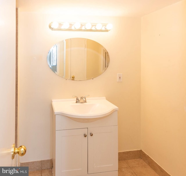 bathroom featuring tile patterned flooring and vanity