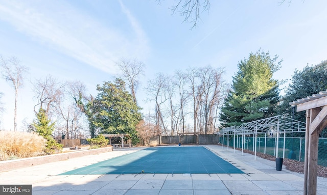 view of swimming pool with a pergola and a patio