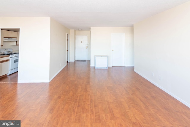 empty room with wood-type flooring