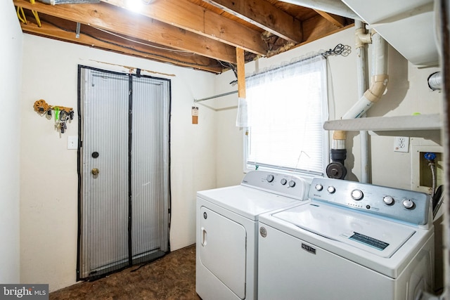 washroom featuring dark colored carpet and washer and clothes dryer