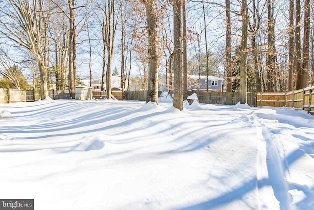 view of yard covered in snow