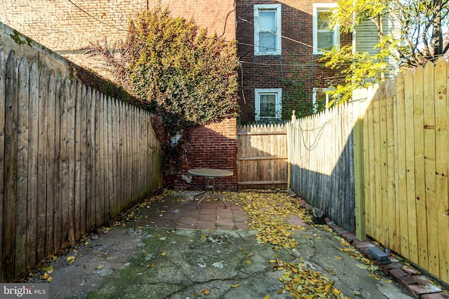 view of side of home featuring a patio area