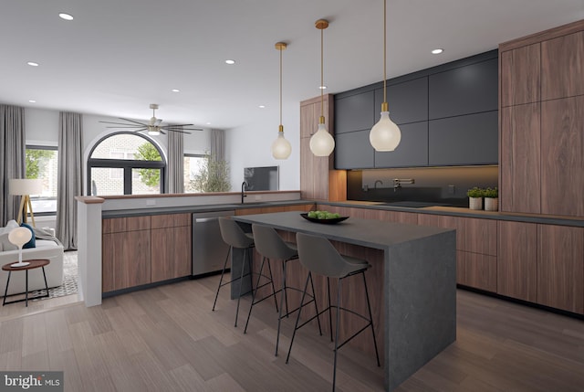 1110 N 3rd St, Philadelphia, PA 19123 - kitchen with dishwasher, modern cabinets, light wood-style flooring, a breakfast bar, and recessed lighting