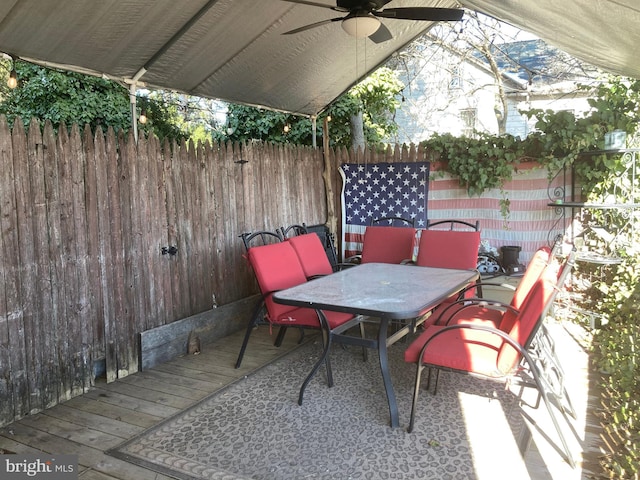 view of patio / terrace featuring ceiling fan and a deck