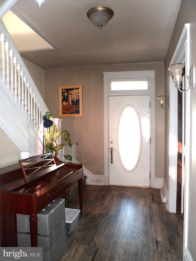 entrance foyer with dark hardwood / wood-style flooring