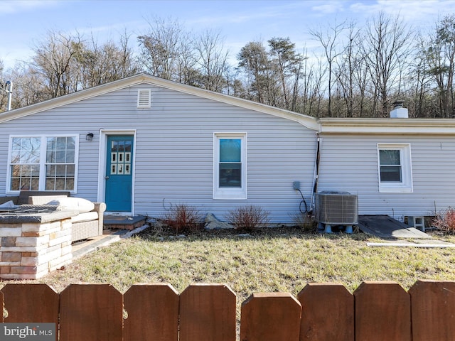 back of property with central air condition unit