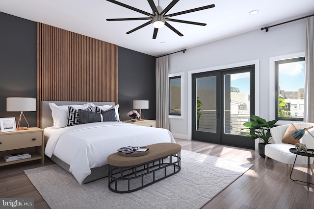 bedroom with ceiling fan, access to exterior, french doors, and wood-type flooring