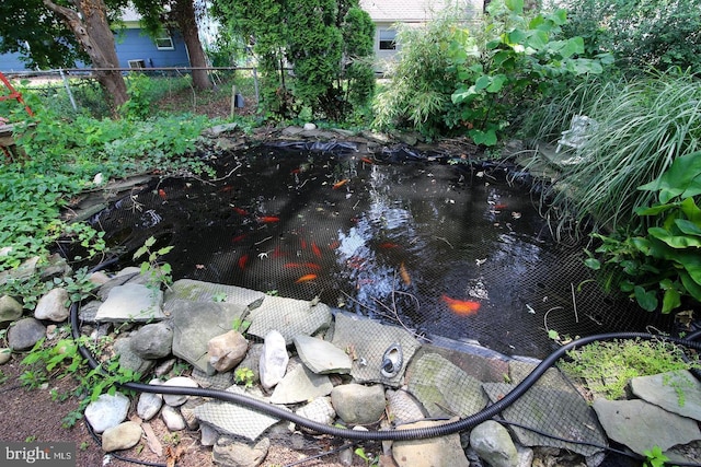 exterior details with a small pond