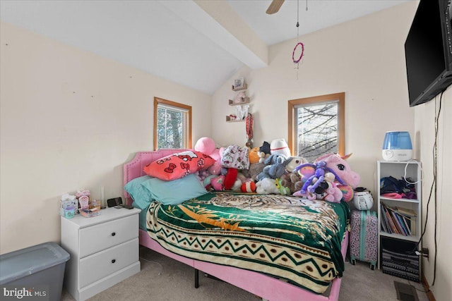 bedroom featuring multiple windows, ceiling fan, light carpet, and vaulted ceiling with beams