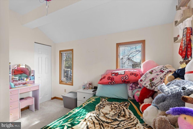 bedroom with lofted ceiling with beams and light colored carpet