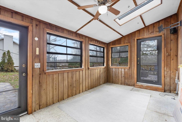 sunroom featuring ceiling fan and vaulted ceiling