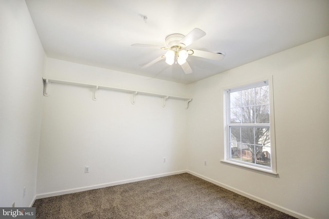 carpeted empty room featuring ceiling fan