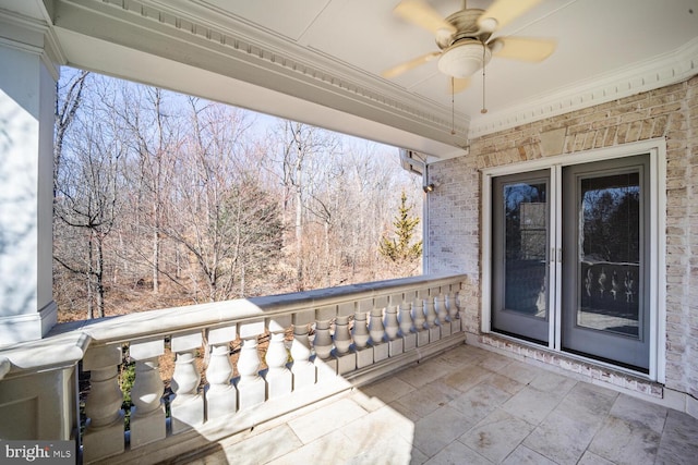 view of patio / terrace featuring ceiling fan and a balcony