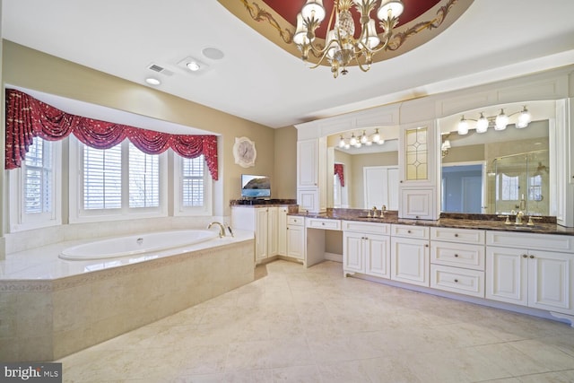 bathroom featuring double vanity, visible vents, an inviting chandelier, a sink, and a bath