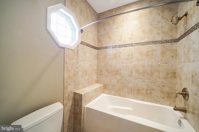 full bathroom featuring tub / shower combination and toilet