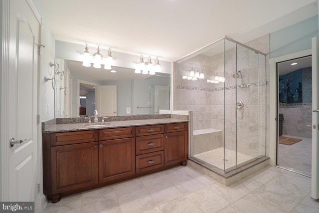 bathroom featuring vanity and a shower stall