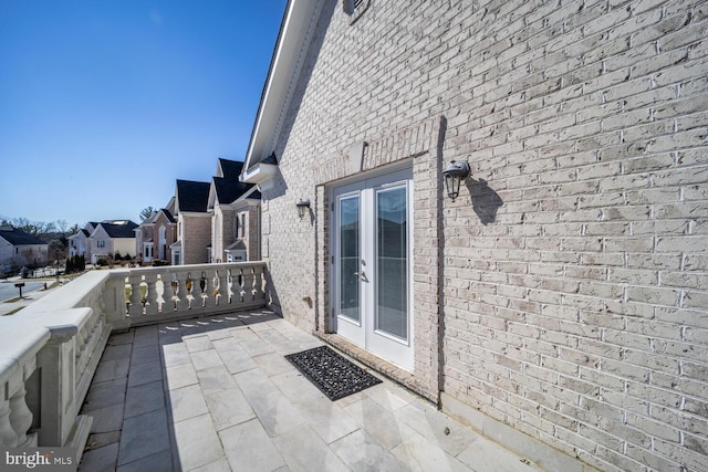 view of patio featuring a residential view and french doors