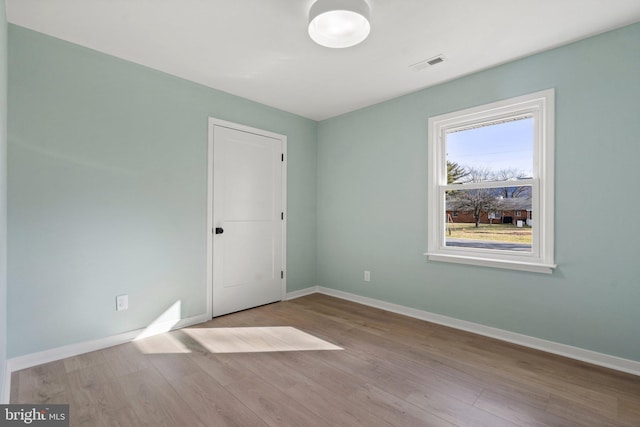 unfurnished room featuring light wood-type flooring